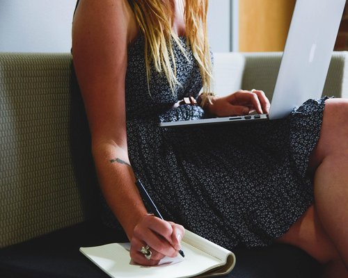 A person taking a mindful break from working on their laptop at home